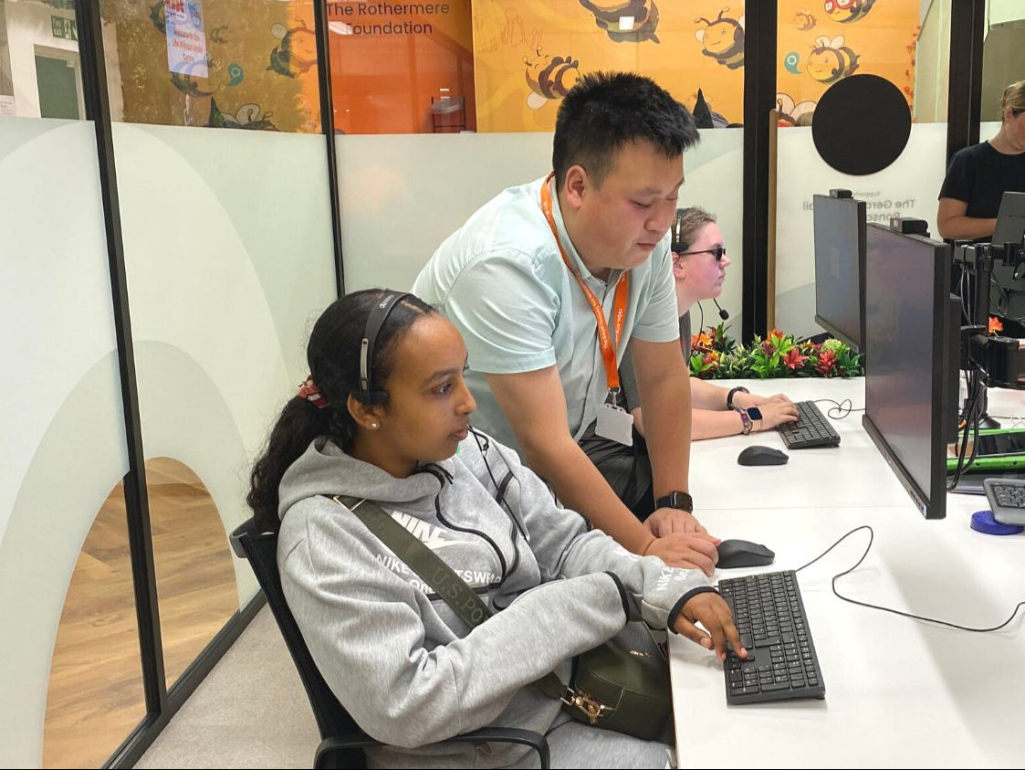 Our accessibility officer Alex is showing a young person at a computer how to use assistive software