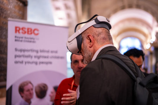 An attendee experiencing the Empatheyes VI simulation headset