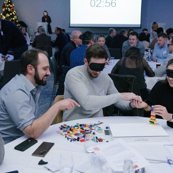 a team of Gresham House staff taking on a blindfolded Lego challenge