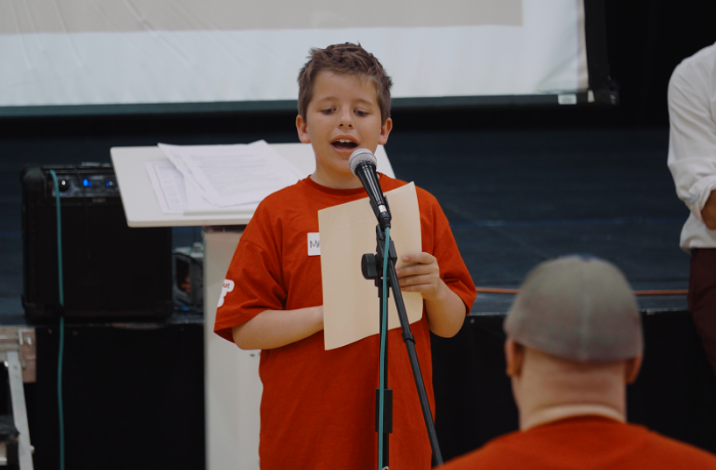 An image of a boy singing