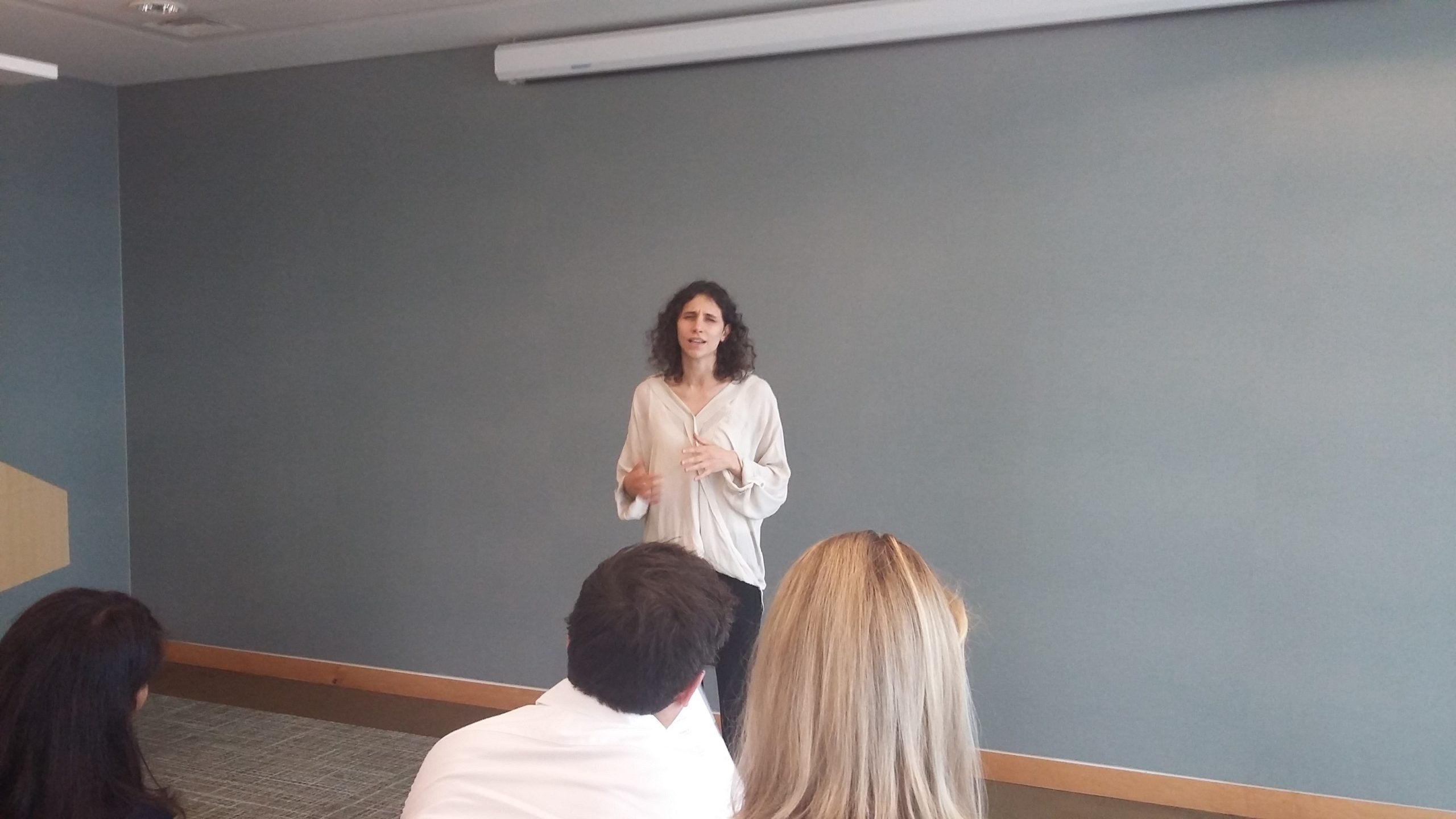 A woman giving a talk at an employment event