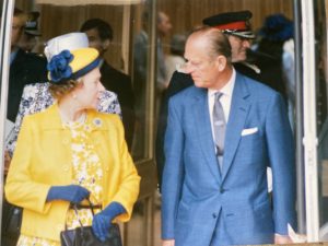 HM Queen Elisabeth and HRH Prince Philip looking at each other 