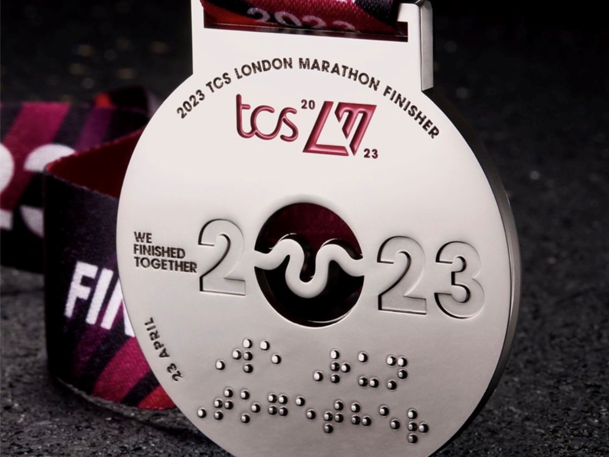 A TCS London Marathon medal with braille that reads: "We run together"