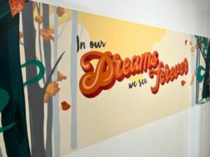 A wall decoration which says: "In our dreams, we see forever."