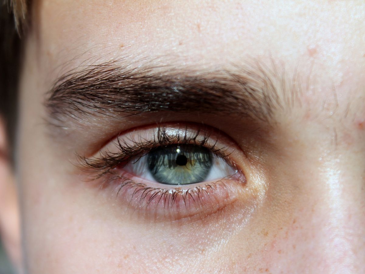 A close-up photo of a light blue eye.