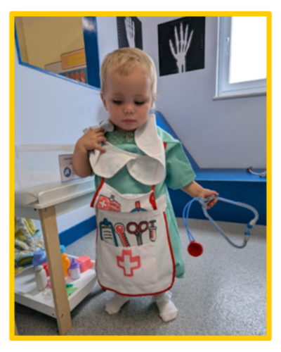 Little Elodie in a doctor costume.